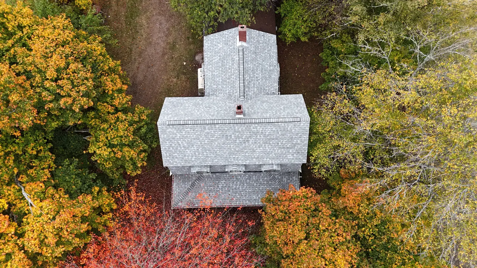 Finished roof in New Brunswick from directly above, new light-grey architectural shingles